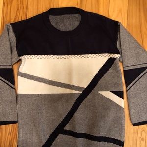 Geometric pattern sweater.